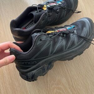 Salomon Black Trail Running Sneakers with Subtle Yellow & Blue Accents